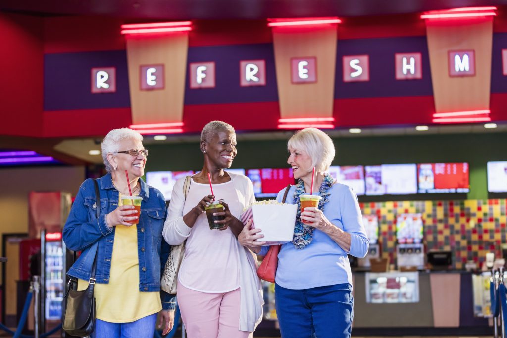 Multi-ethnic senior women at the movies near Broadview Senior Living