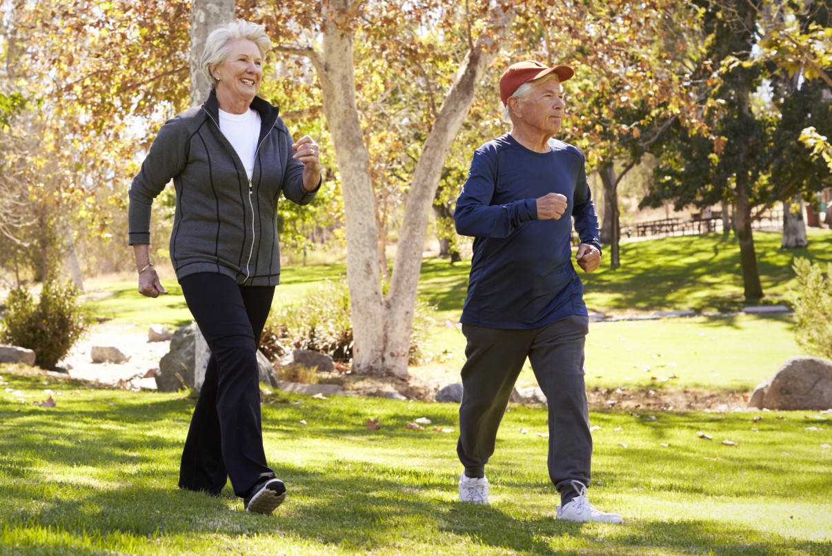 Vibrant seniors taking a walk outdoors